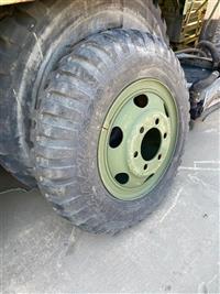 TI-101 | TI-101 9.00 x 20 Military Tread NDT Bias Ply Tire Mounted on 6 Hole Budd Rim  (1).jpg