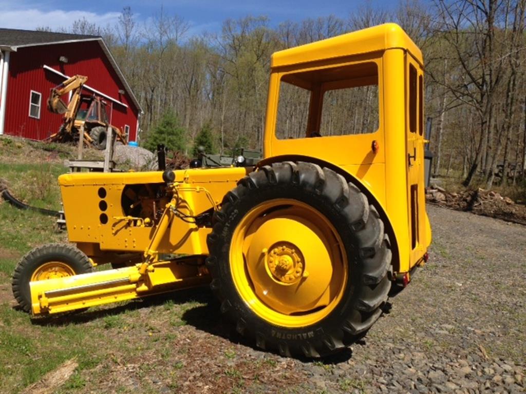 3dc96821-a13f-4436-a10c-fa2a9b93f49c-04182018-cropped-Huber%20Road%20Grader%20(32)